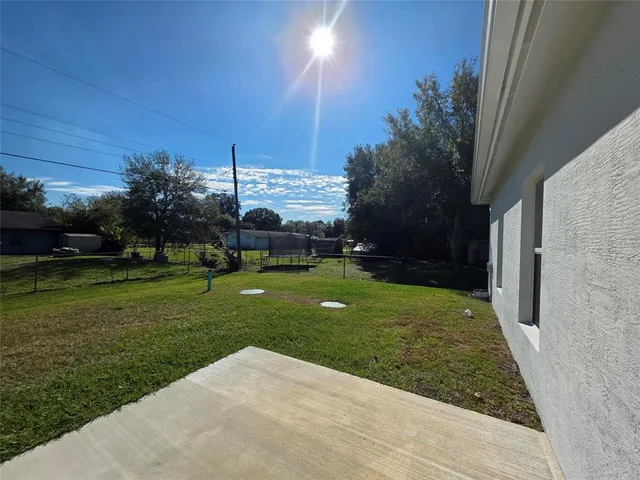 a view of a garden with a building