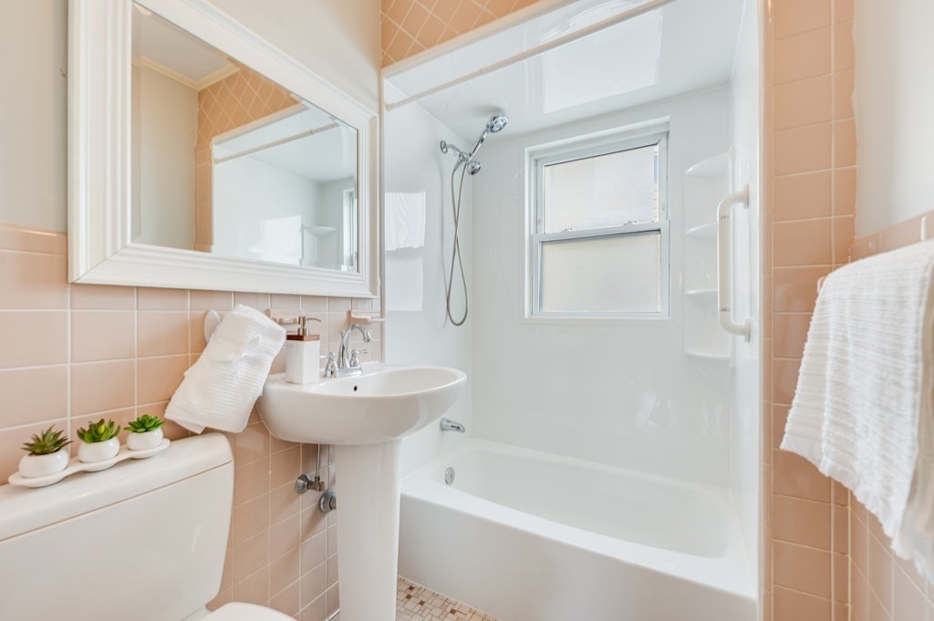 44 Jasper Street Saugus, MA 01906 - Photo 19 of 32 a bathroom with a sink toilet and shower