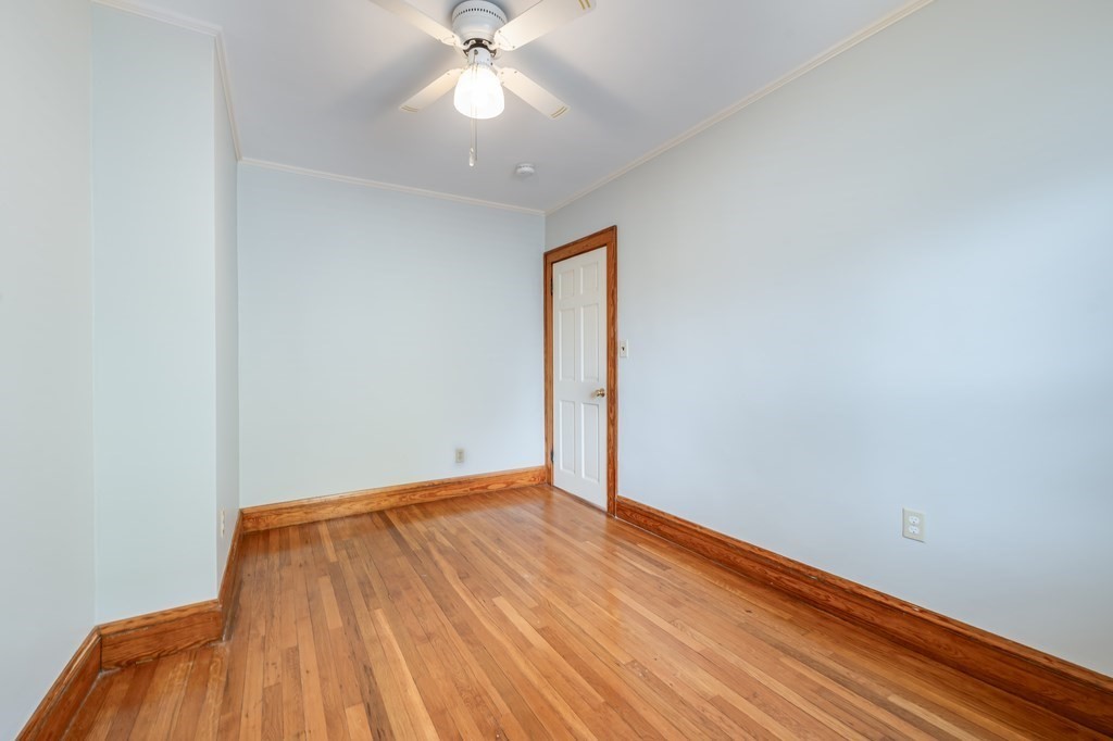 44 Jasper Street Saugus, MA 01906 - Photo 20 of 32 an empty room with a hardwood and ceiling fan