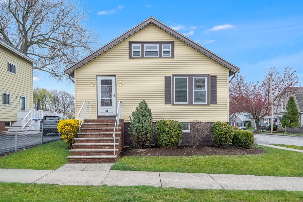 44 Jasper Street Saugus, MA 01906 - Photo 2 of 32 a view of a house with a yard and plants