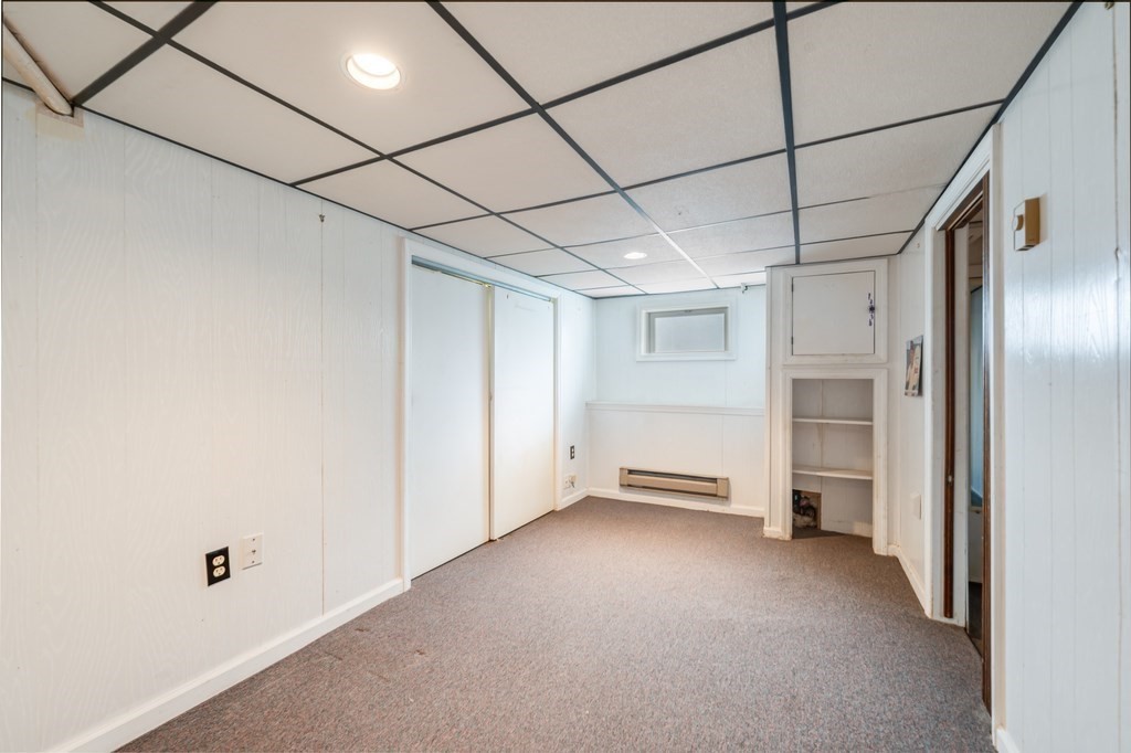 44 Jasper Street Saugus, MA 01906 - Photo 27 of 32 a view of empty room with a fireplace