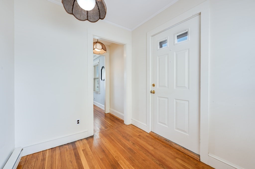44 Jasper Street Saugus, MA 01906 - Photo 4 of 32 a view of a hallway with wooden floor
