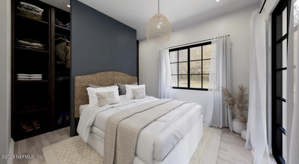 3381 3rd Street Elkton, FL 32033 - Photo 2 of 6 a bedroom with a bed and a window