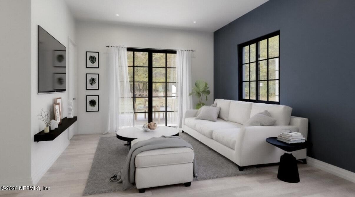 3381 3rd Street Elkton, FL 32033 - Photo 4 of 6 a living room with furniture and a window