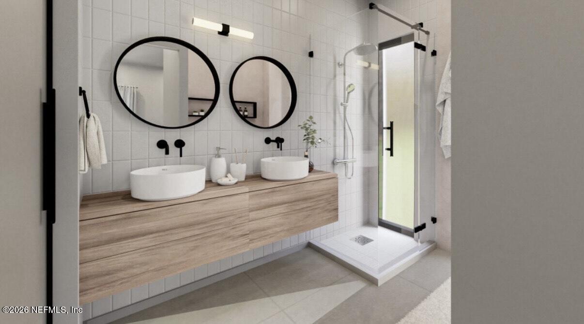 3381 3rd Street Elkton, FL 32033 - Photo 5 of 6 a bathroom with a double vanity sink and a mirror