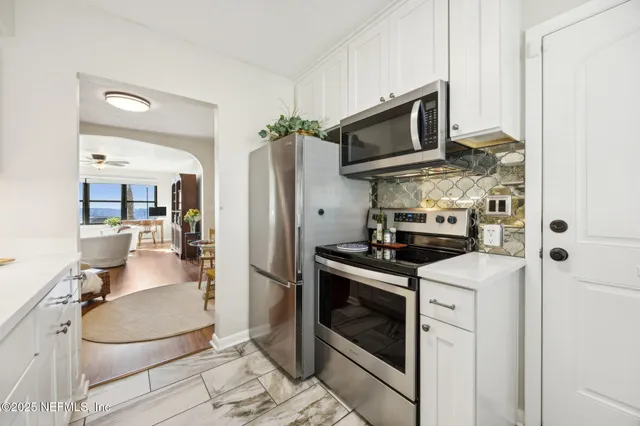 a bedroom with a bed furniture and a book shelf