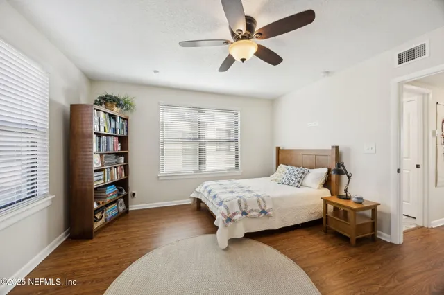 a bathroom with a sink a toilet and a window