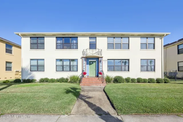 front view of a house with a yard