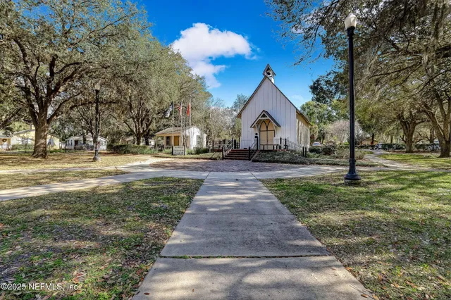 a view of a swimming pool with an outdoor space and seating area