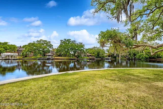 a view of swimming pool with outdoor seating and city view