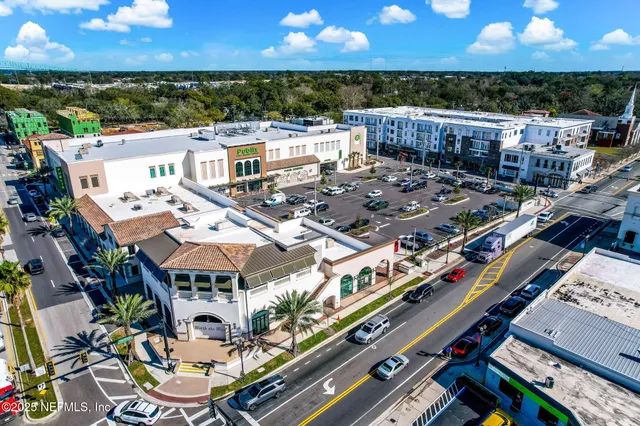 an aerial view of a house with a lake view