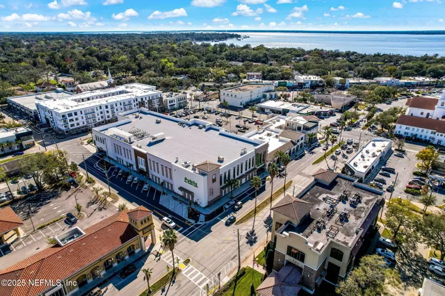 an aerial view of residential house with outdoor space and parking