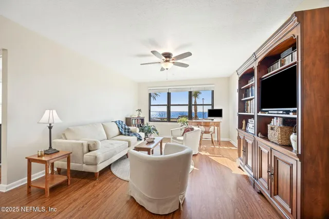 a bedroom with a bed furniture and a book shelf
