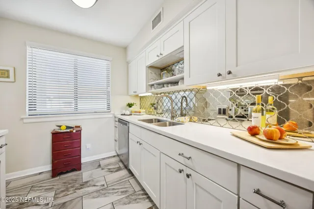 a view of a house with backyard and porch