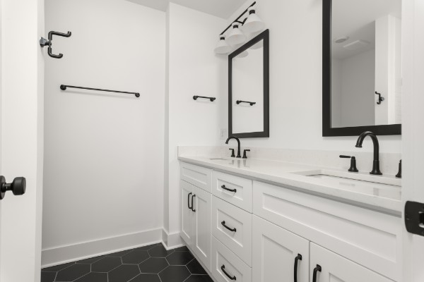 109 Chadwick Court Madison, TN 37115 - Photo 8 of 21 a bathroom with double sink and a mirror