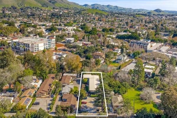 an aerial view of residential building with parking space