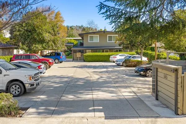 a view of a car parked in front of a house