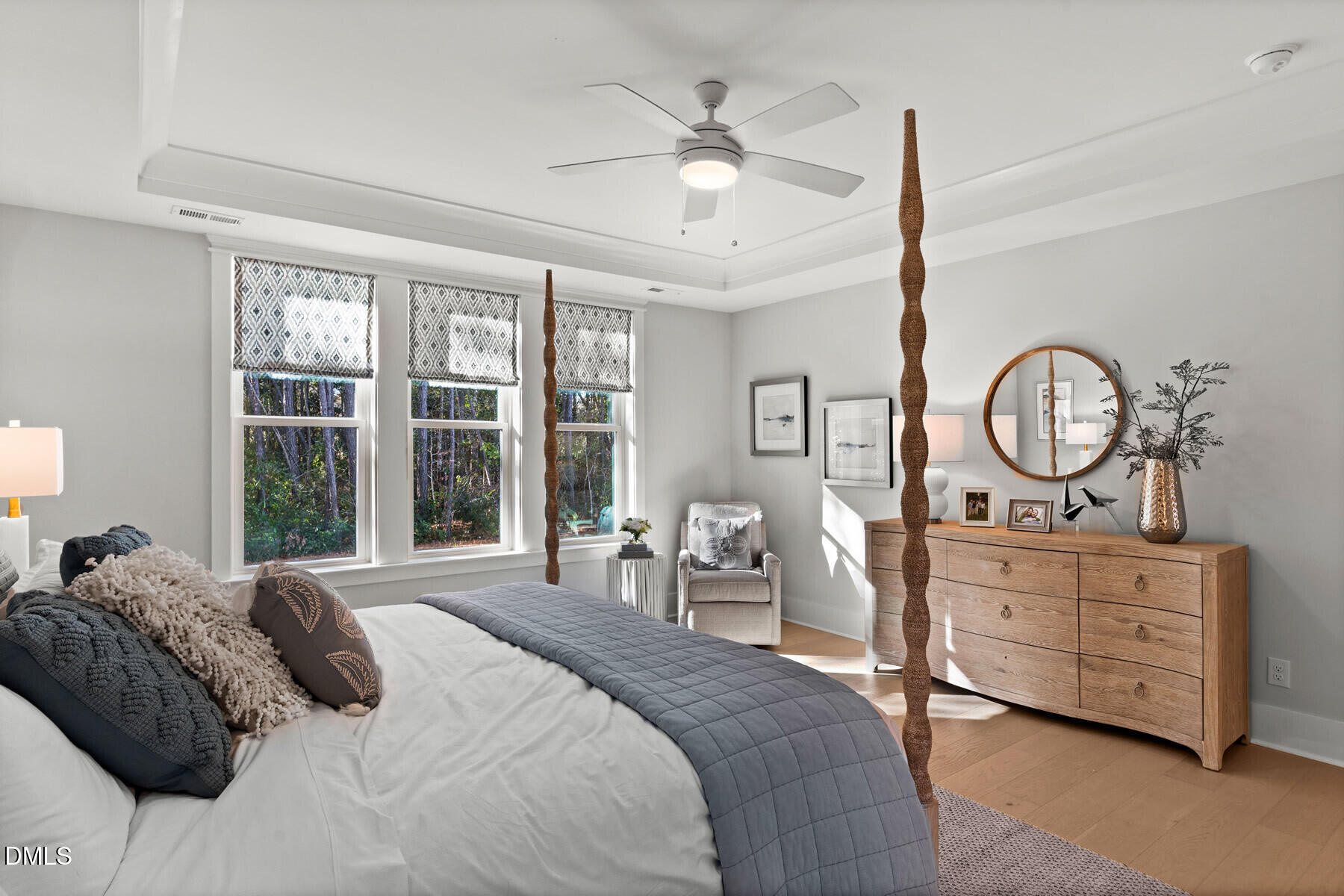 8116 Andrea Lane, Unit 101 Raleigh, NC 27613 - Photo 10 of 17 a bedroom with a large bed and a large dresser