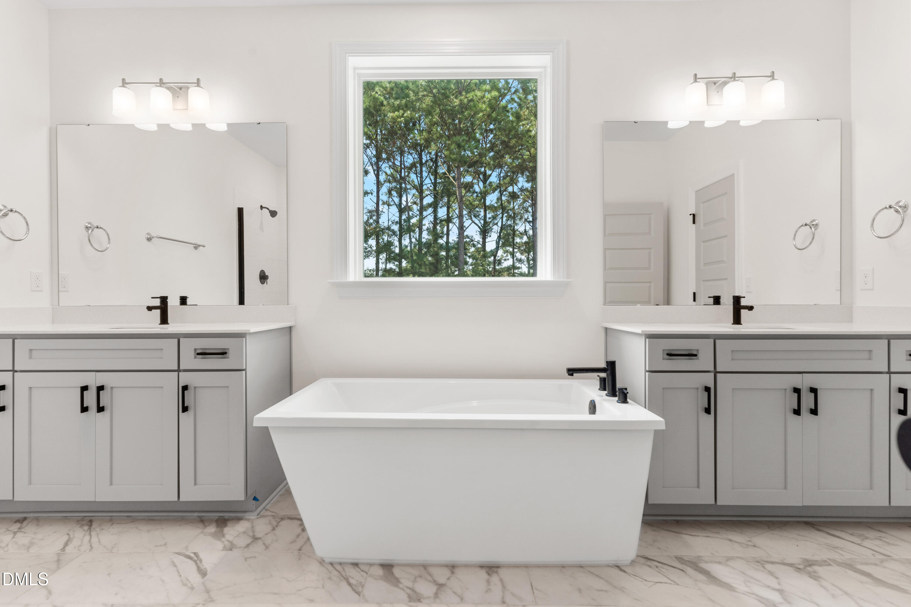 8116 Andrea Lane, Unit 101 Raleigh, NC 27613 - Photo 12 of 17 a white bath tub sitting in a bathroom