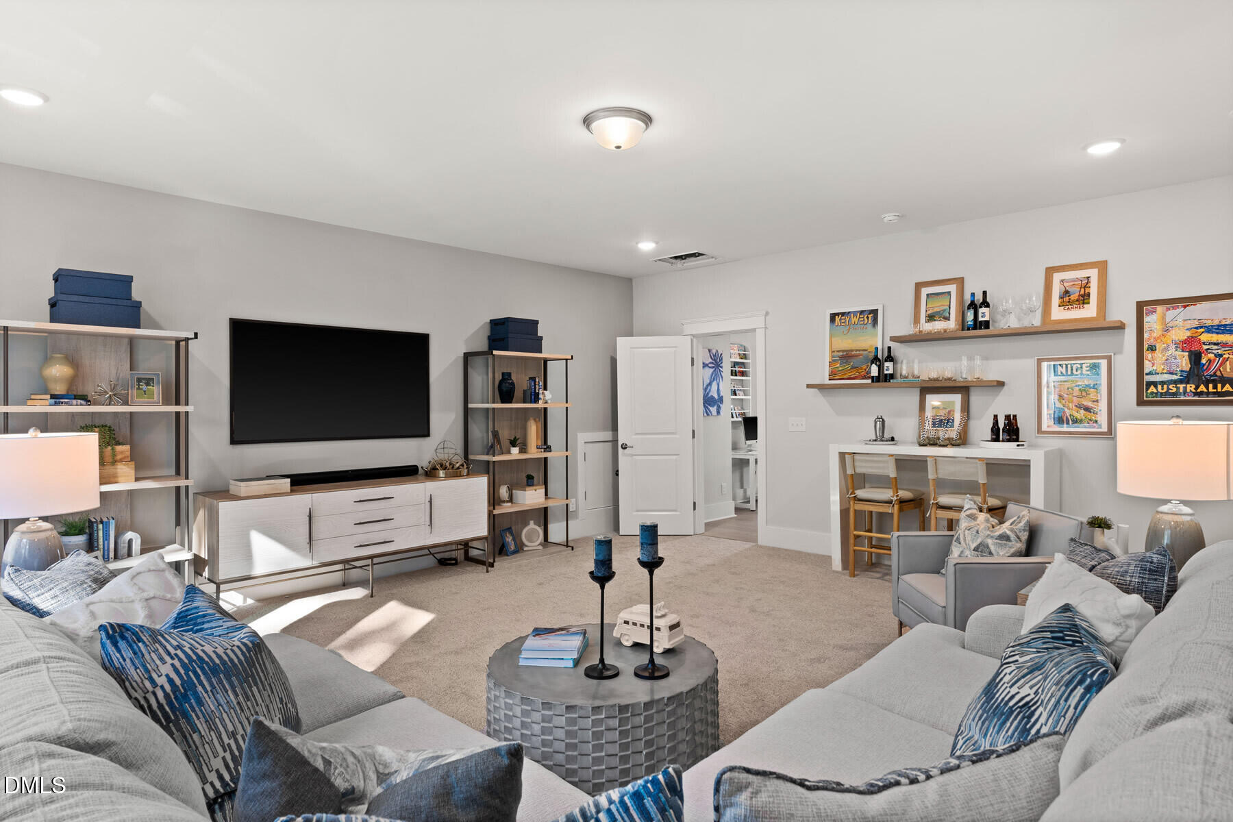 8116 Andrea Lane, Unit 101 Raleigh, NC 27613 - Photo 14 of 17 a living room with furniture and a flat screen tv