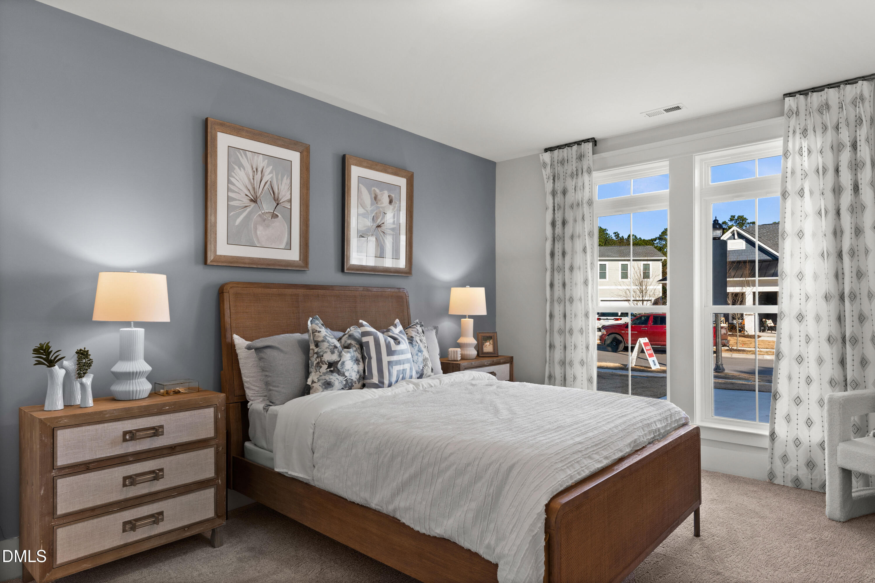 8116 Andrea Lane, Unit 101 Raleigh, NC 27613 - Photo 15 of 17 a bedroom with a bed and a window