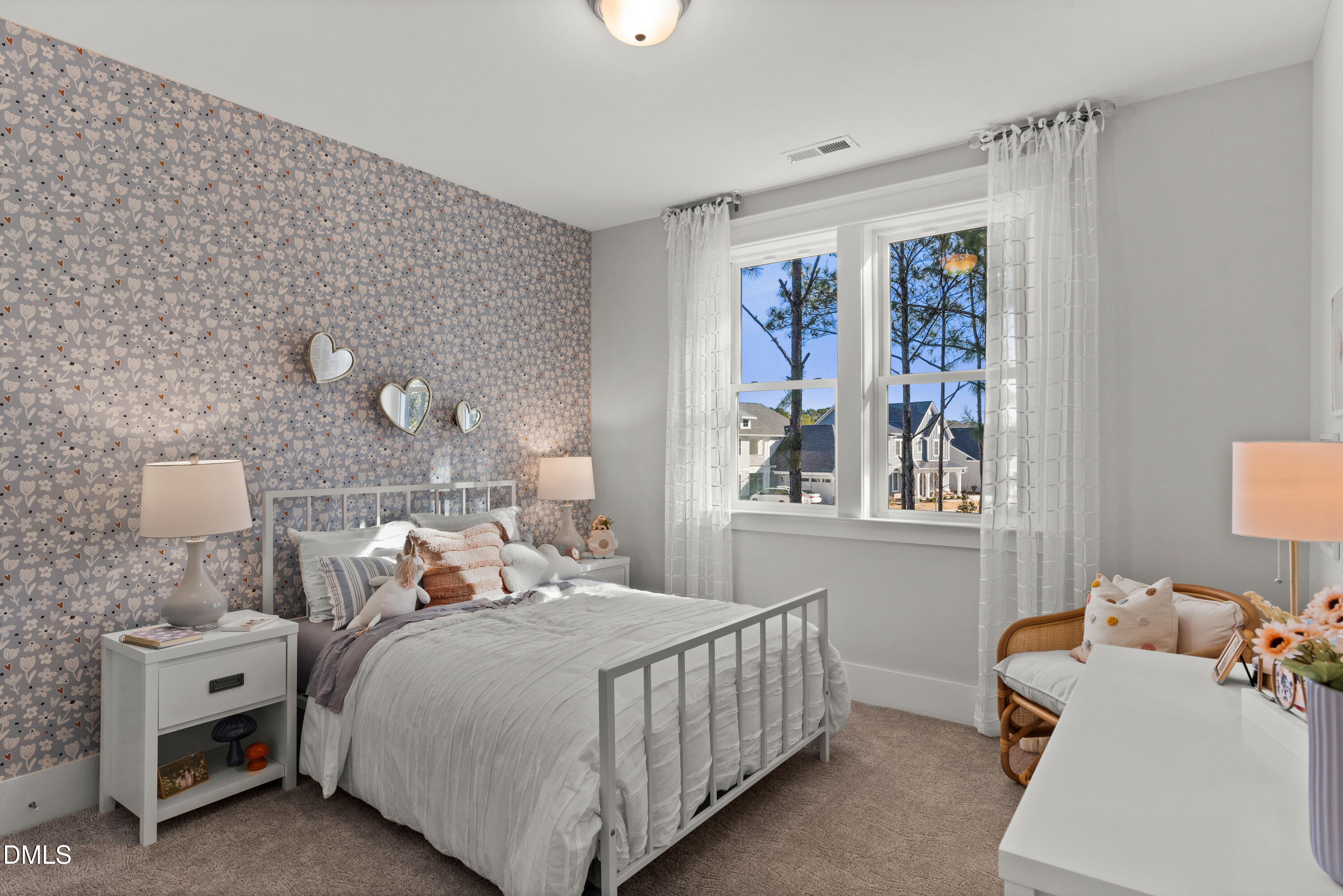 8116 Andrea Lane, Unit 101 Raleigh, NC 27613 - Photo 16 of 17 a bedroom with a bed and a window