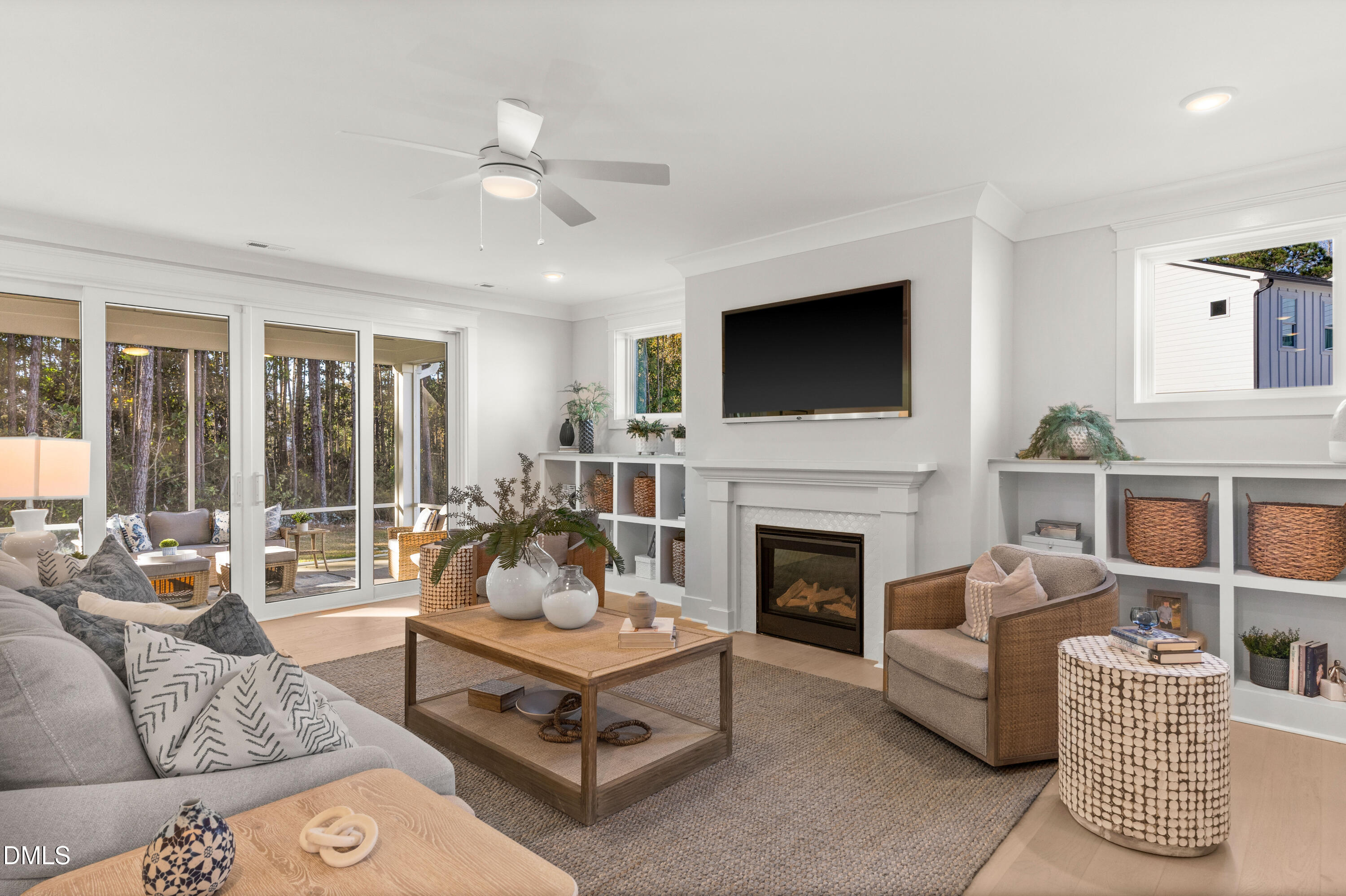 8116 Andrea Lane, Unit 101 Raleigh, NC 27613 - Photo 4 of 17 a living room with furniture a fireplace and a flat screen tv