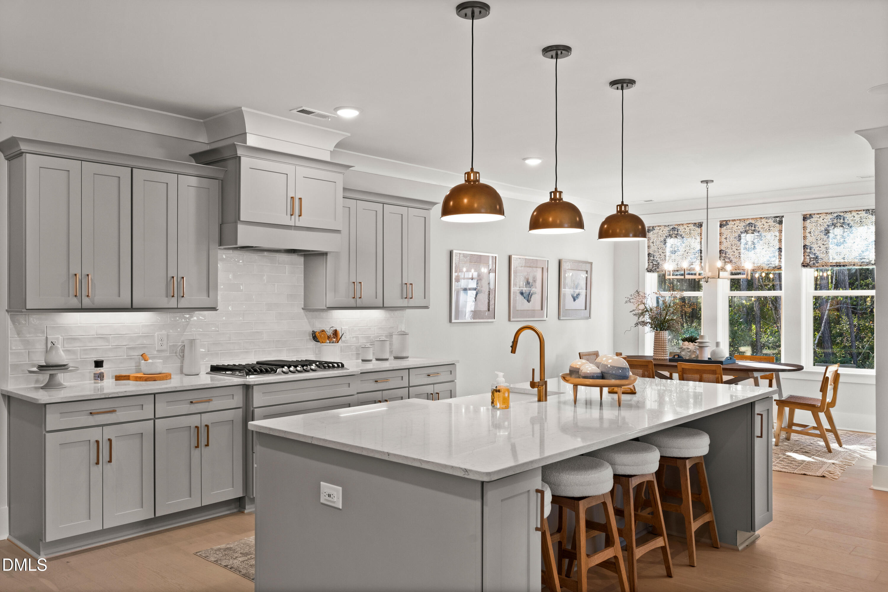 8116 Andrea Lane, Unit 101 Raleigh, NC 27613 - Photo 6 of 17 a kitchen with stainless steel appliances granite countertop a sink a stove and a wooden floors