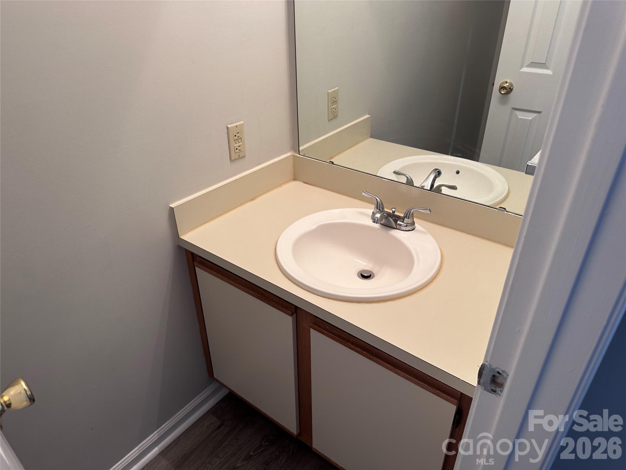 6725 Bevington Ridge Road, Unit A/B Charlotte, NC 28277 - Photo 13 of 48 a bathroom with a sink and a mirror