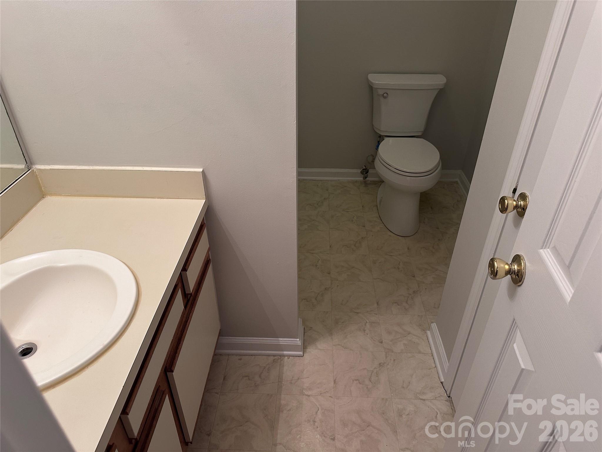 6725 Bevington Ridge Road, Unit A/B Charlotte, NC 28277 - Photo 16 of 48 a bathroom with a sink and toilet