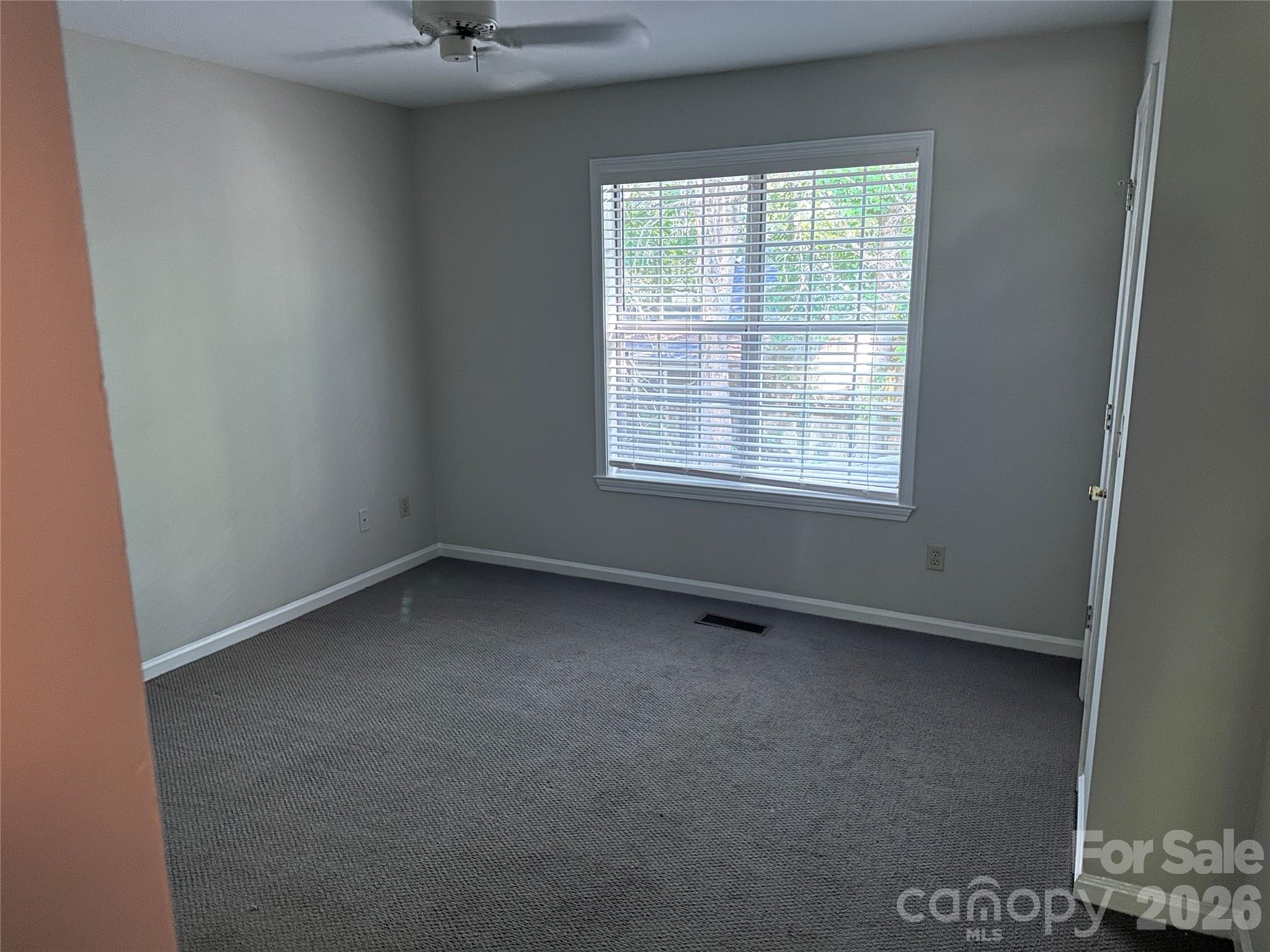 6725 Bevington Ridge Road, Unit A/B Charlotte, NC 28277 - Photo 19 of 48 an empty room with a window