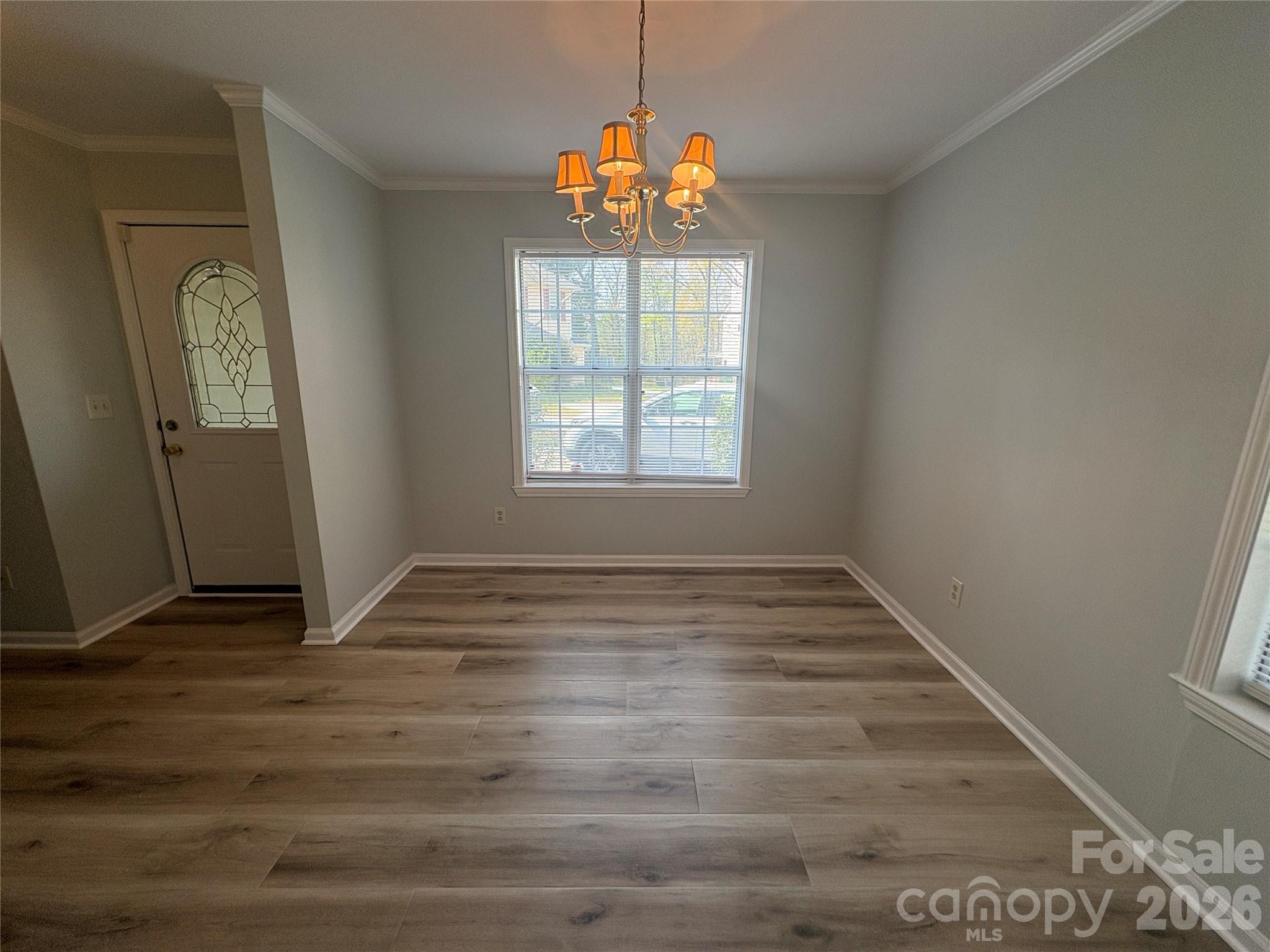 6725 Bevington Ridge Road, Unit A/B Charlotte, NC 28277 - Photo 26 of 48 an empty room with wooden floor and windows