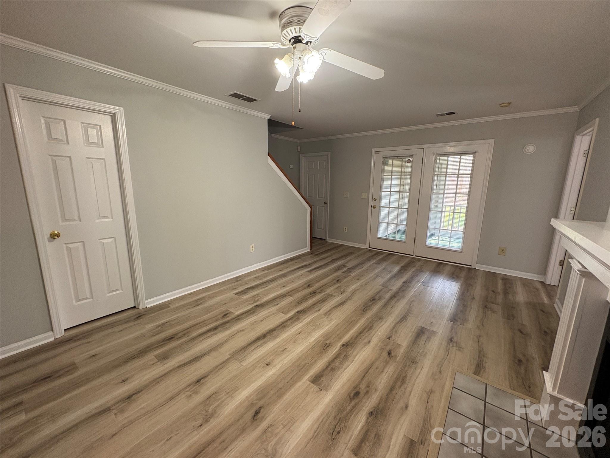 6725 Bevington Ridge Road, Unit A/B Charlotte, NC 28277 - Photo 27 of 48 wooden floor in an empty room with a window