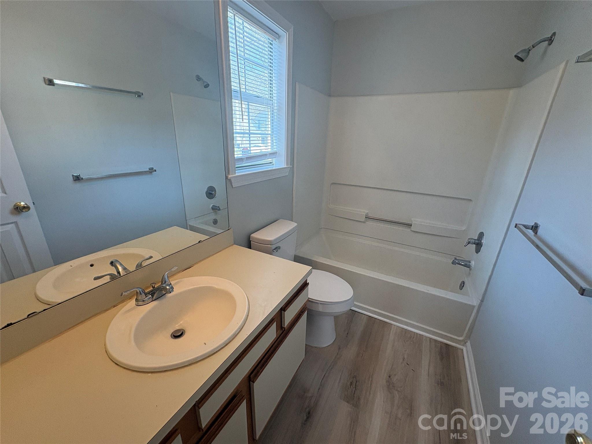 6725 Bevington Ridge Road, Unit A/B Charlotte, NC 28277 - Photo 34 of 48 a bathroom with a tub sink and toilet