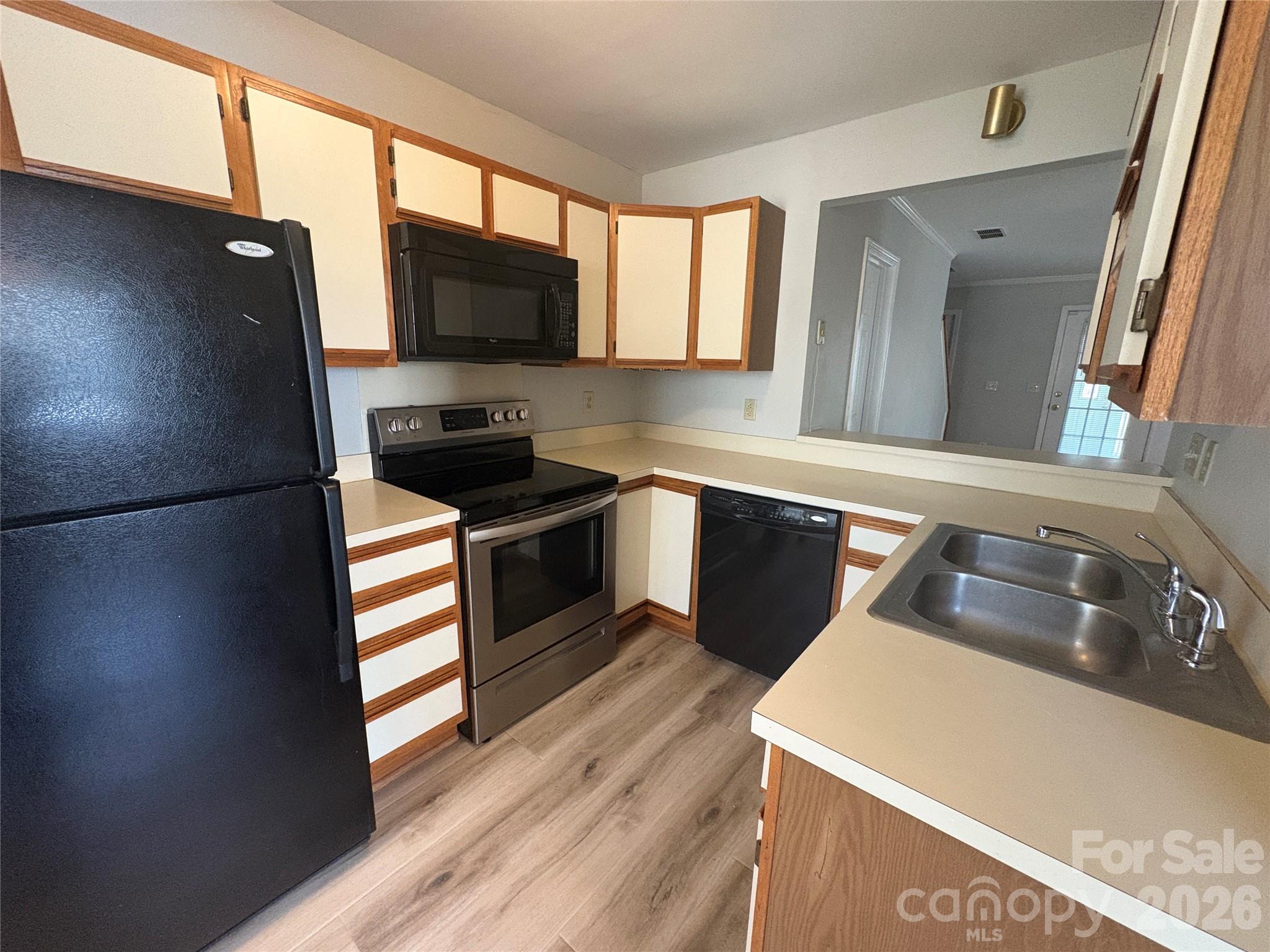 6725 Bevington Ridge Road, Unit A/B Charlotte, NC 28277 - Photo 36 of 48 a kitchen with granite countertop a refrigerator stove and sink