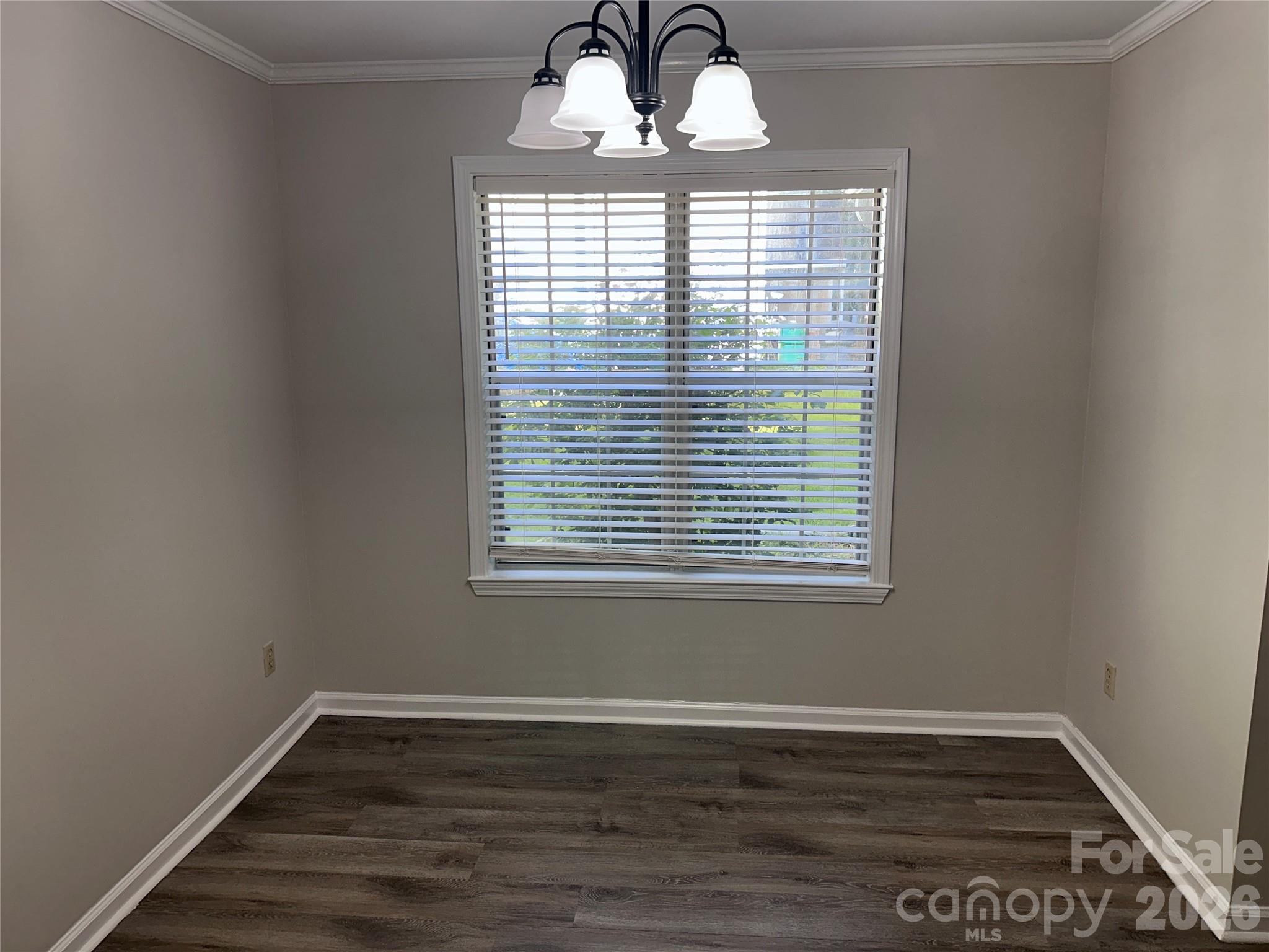 6725 Bevington Ridge Road, Unit A/B Charlotte, NC 28277 - Photo 5 of 48 wooden floor in an empty room with a window