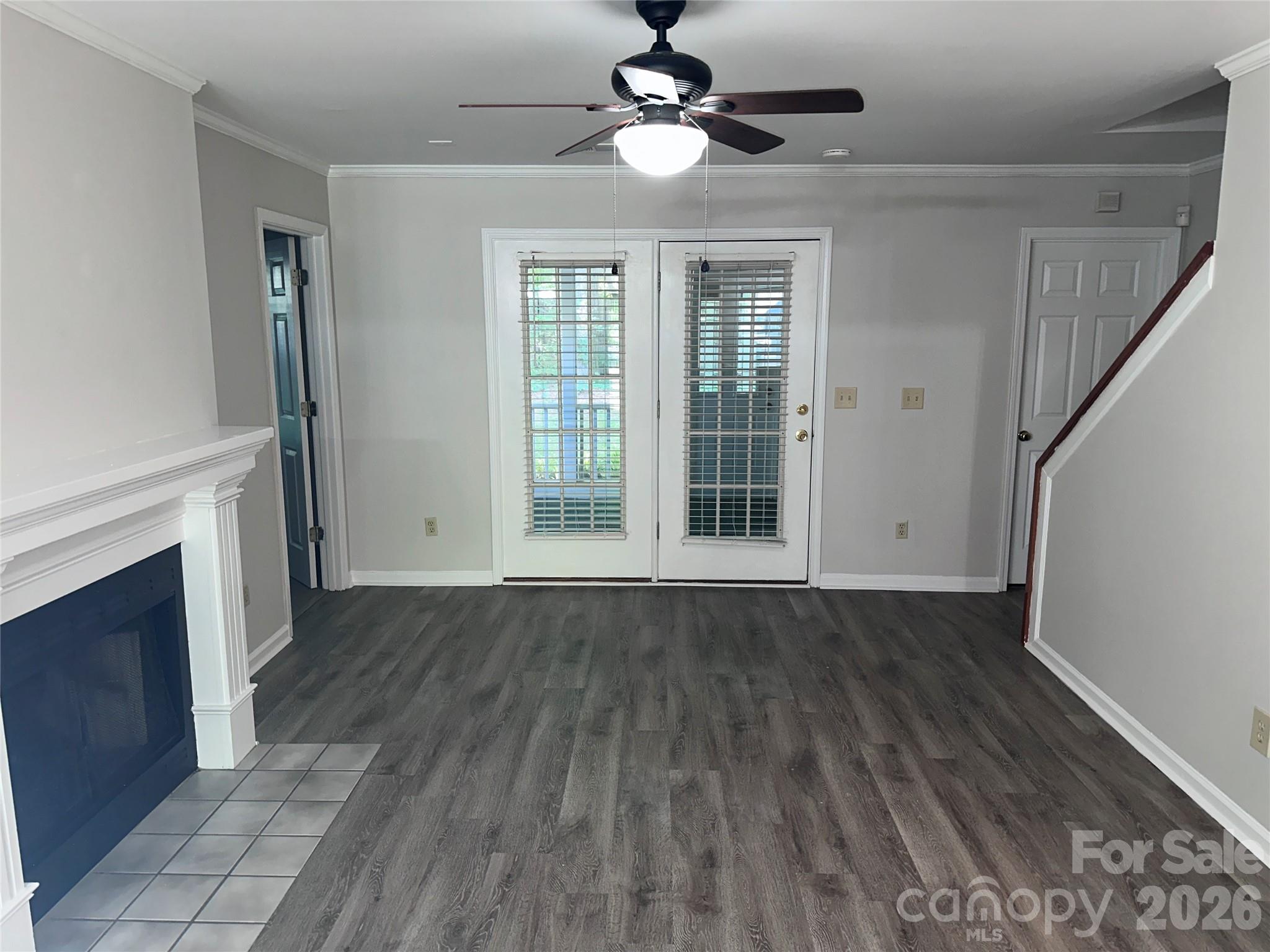 6725 Bevington Ridge Road, Unit A/B Charlotte, NC 28277 - Photo 8 of 48 a view of empty room with wooden floor and fireplace