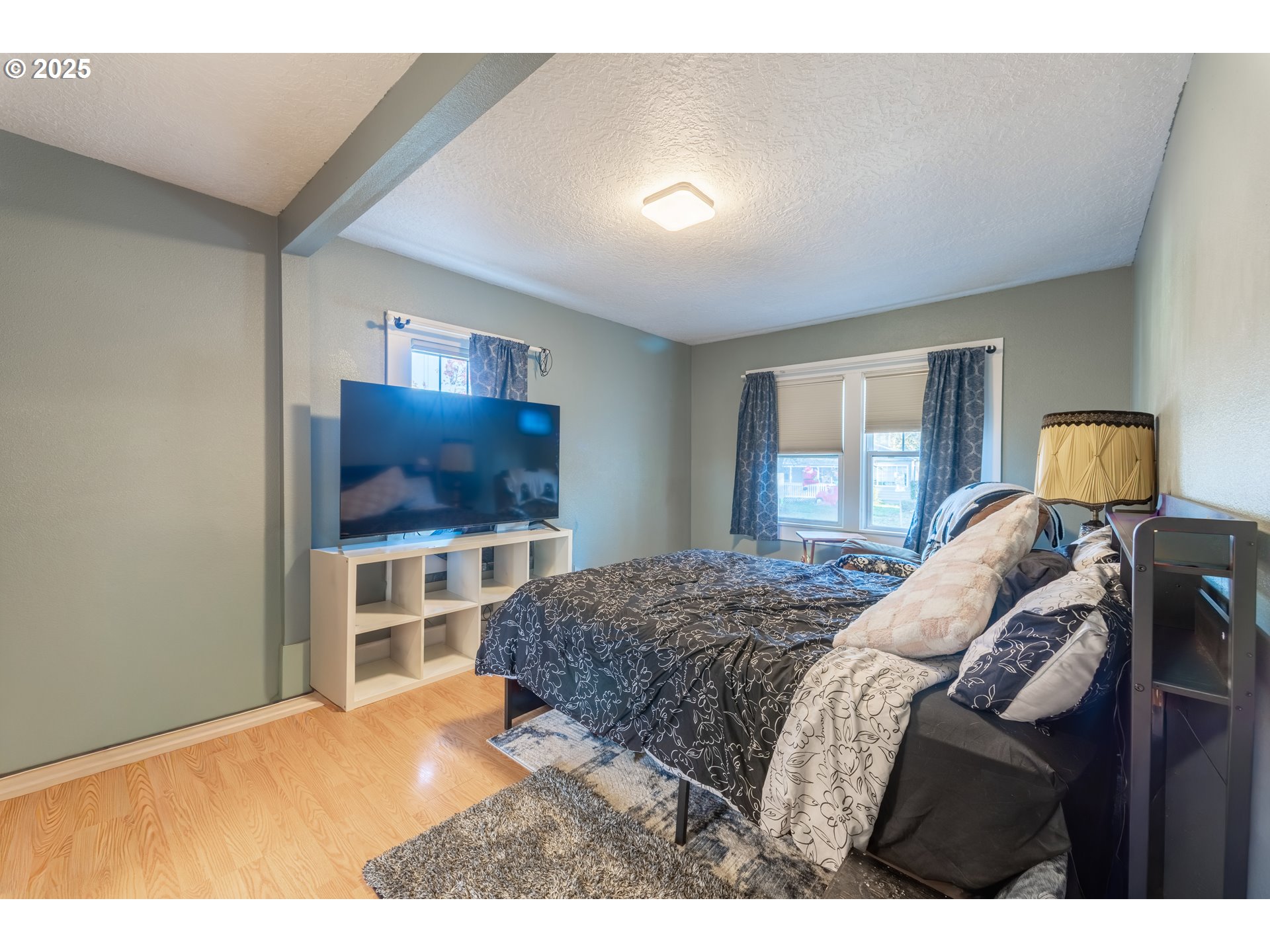 745 16th Street Northeast Salem, OR 97301 - Photo 11 of 32 a bedroom with a bed window and television