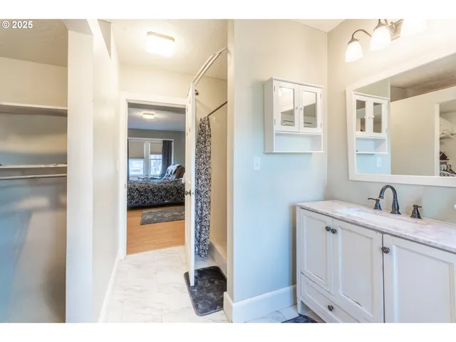 a bathroom with a toilet sink and a window