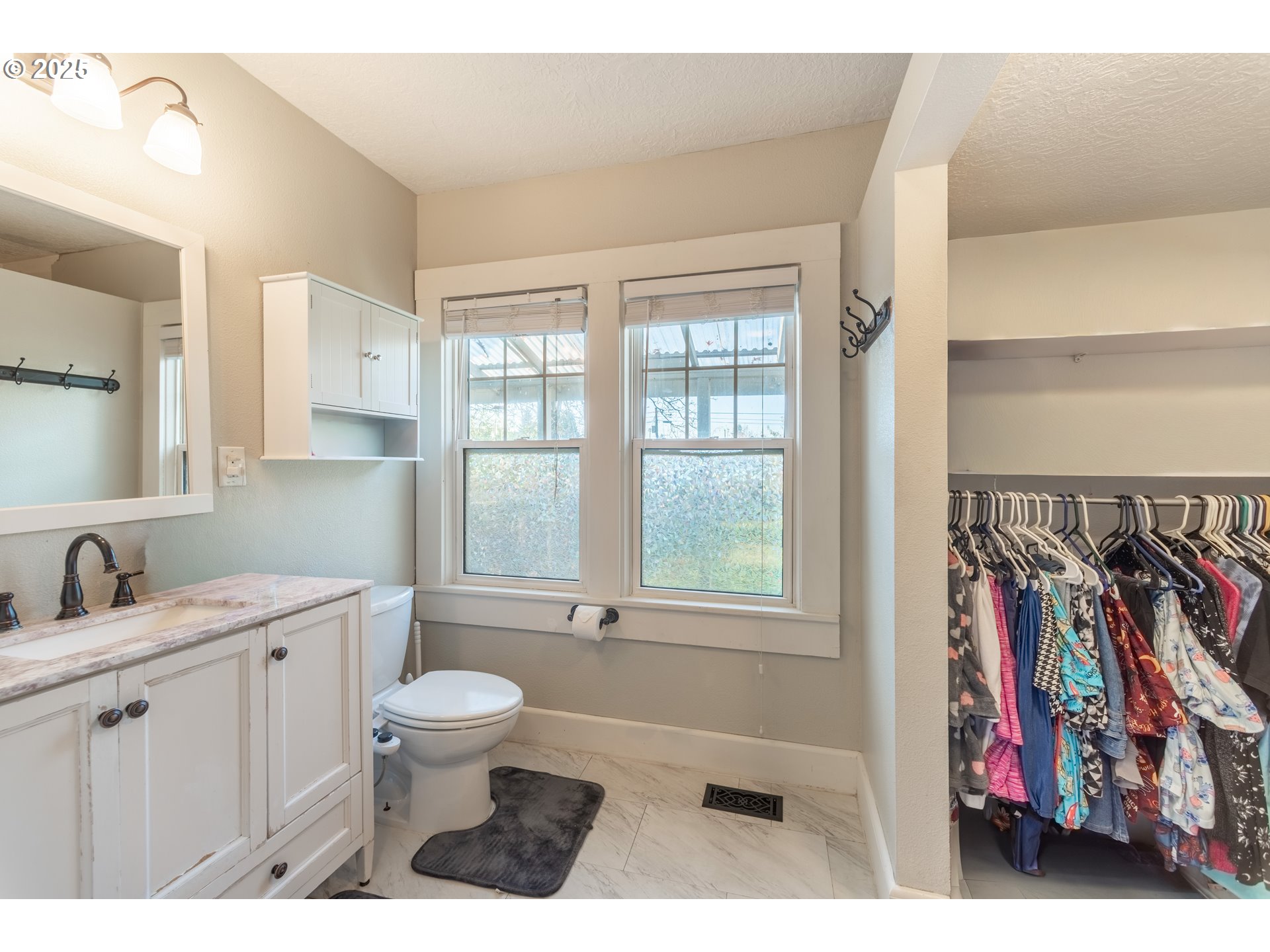 745 16th Street Northeast Salem, OR 97301 - Photo 15 of 32 a bathroom with a toilet sink and a window