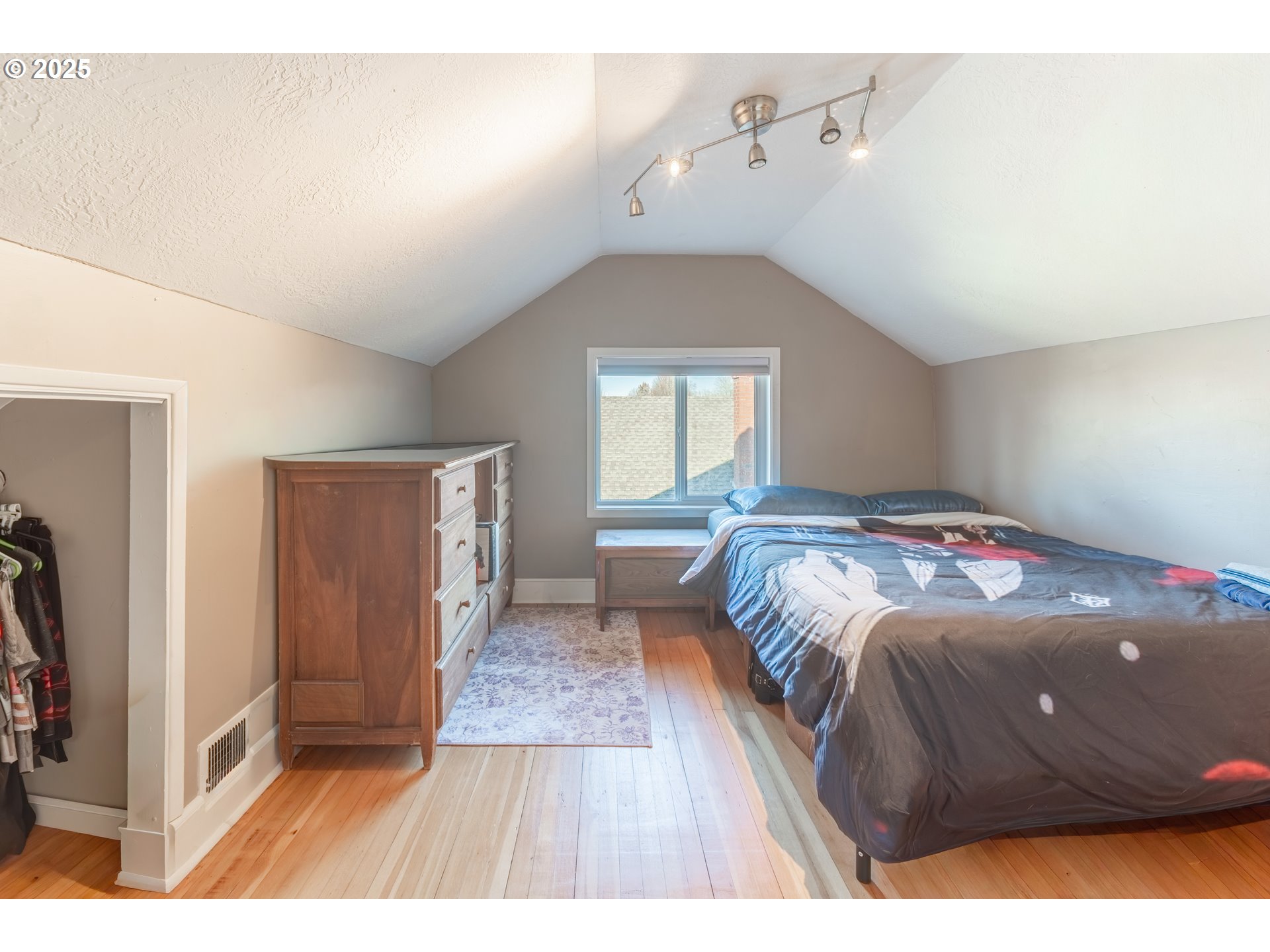 745 16th Street Northeast Salem, OR 97301 - Photo 16 of 32 a bedroom with a bed and a window