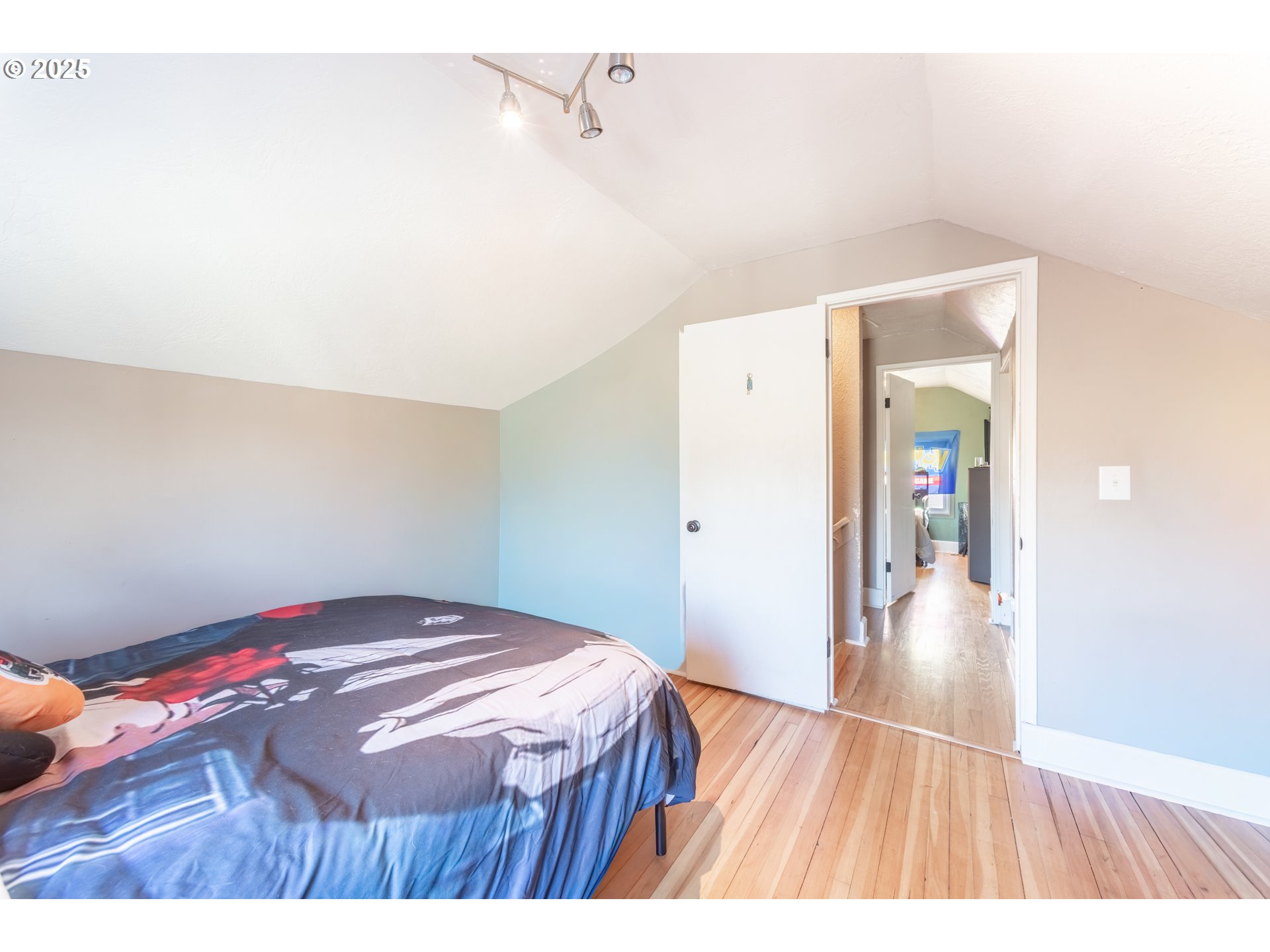 745 16th Street Northeast Salem, OR 97301 - Photo 17 of 32 a bedroom with a bed and a table in it