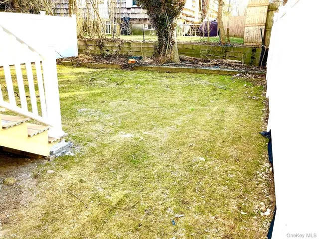 a view of a house with a small deck