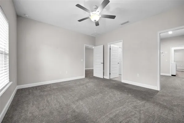 a view of an empty room and a window