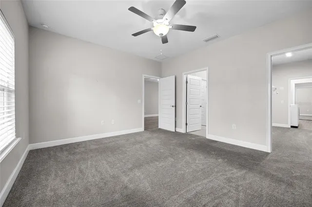 a view of an empty room and a window