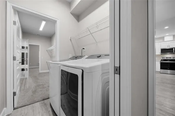 a utility room with washer and dryer