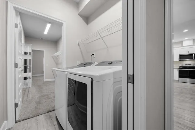 a utility room with washer and dryer