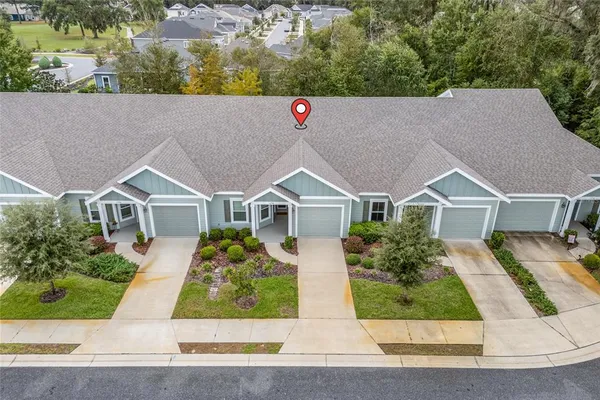 an aerial view of house with yard