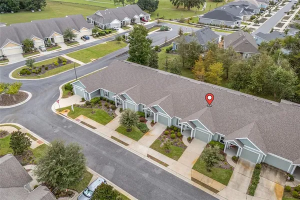 an aerial view of a house and outdoor space