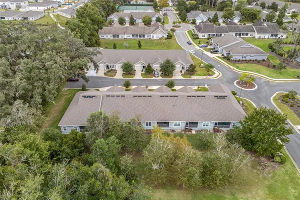an aerial view of a house with a swimming pool yard and outdoor seating